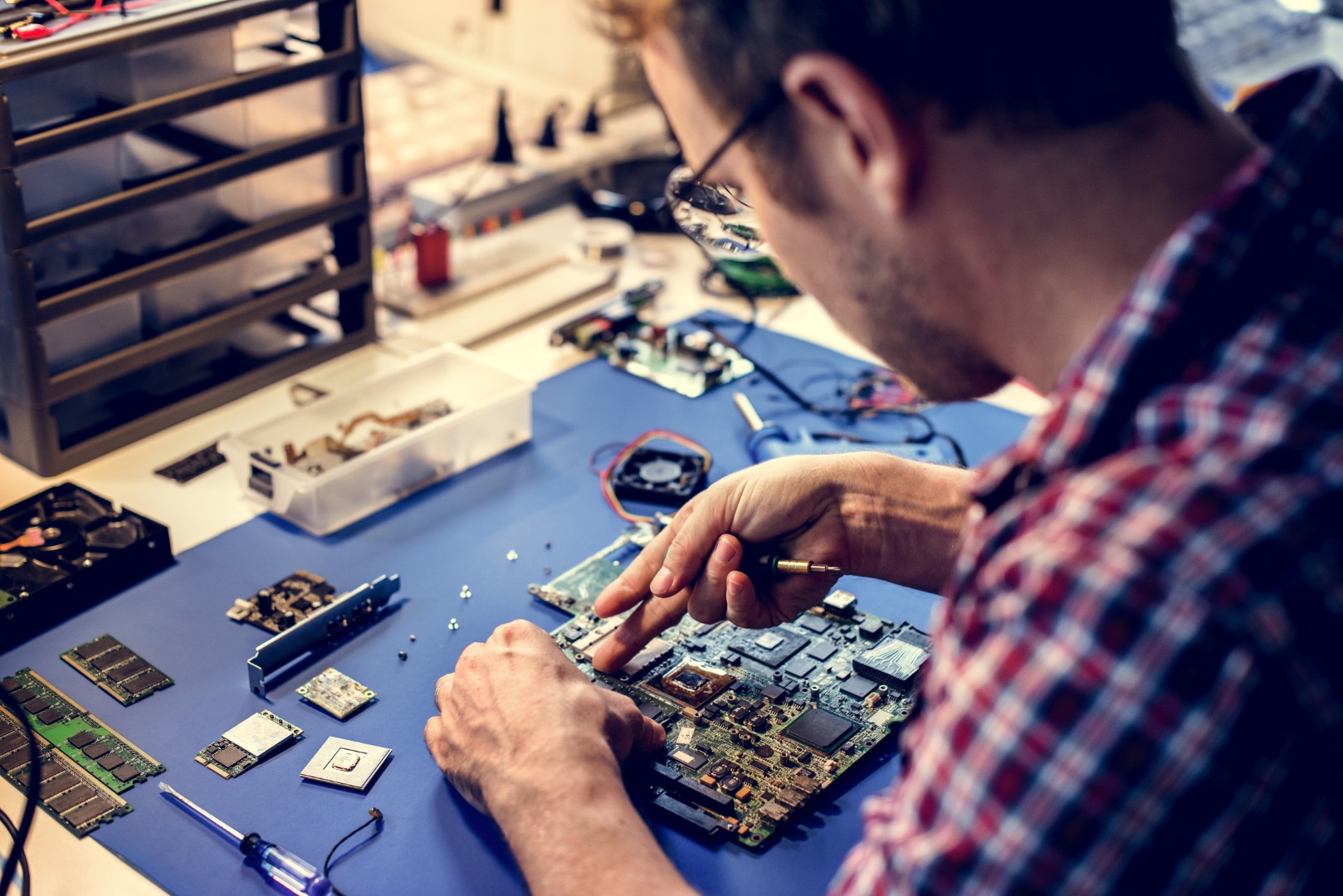 Technicians working on computer mainboard